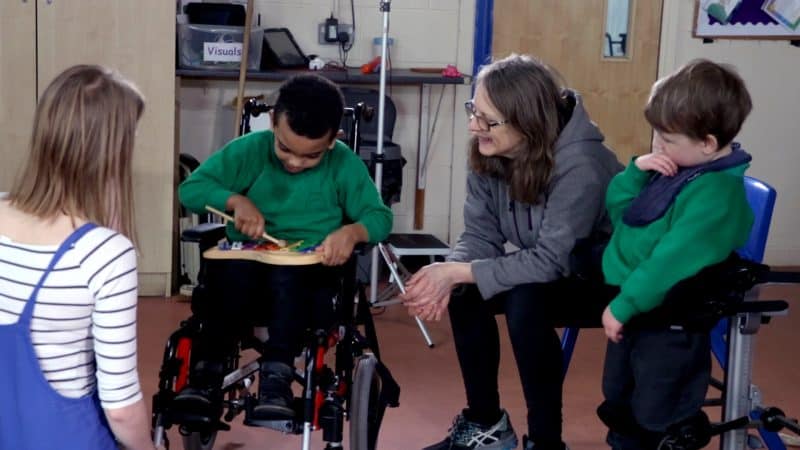 Children playing the song Incy Wincy Spider on an instrument.